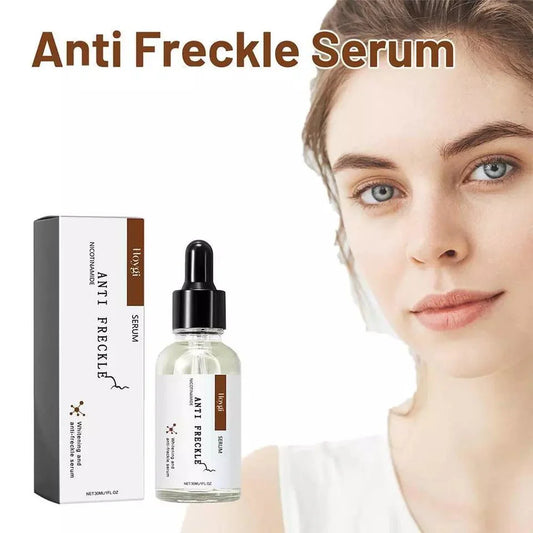 Anti-freckle face serum bottle with black dropper beside white box