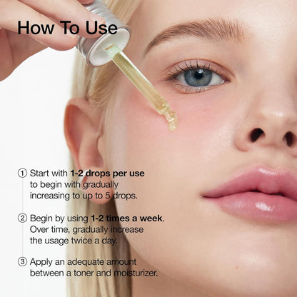Anua 10+ serum dropper releases clear gel onto face, green bottle and silver cap