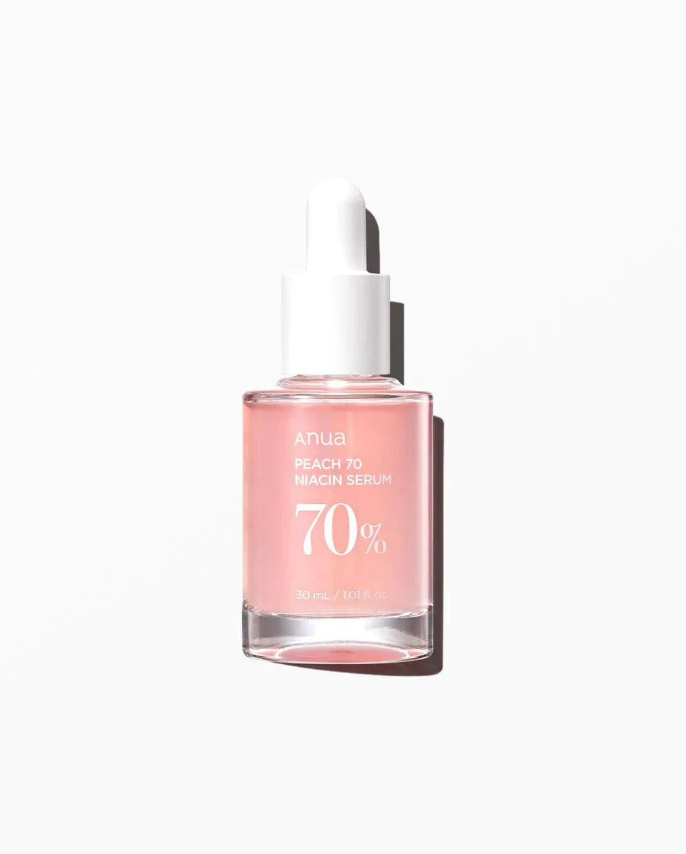 Anua Peach 70% Niacin Serum bottle with white dropper, pink glass vial