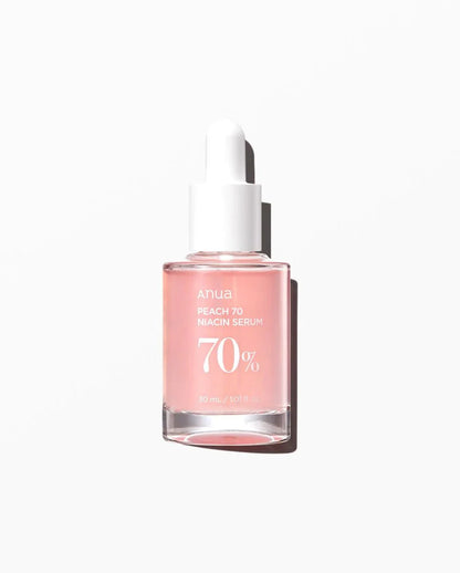 Anua Peach 70% Niacin Serum bottle with white dropper, pink glass vial