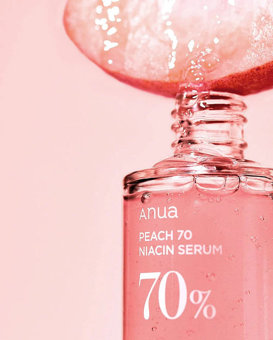 Anua Peach 70% Niacin Serum bottle with dropper, pink glass vial with label