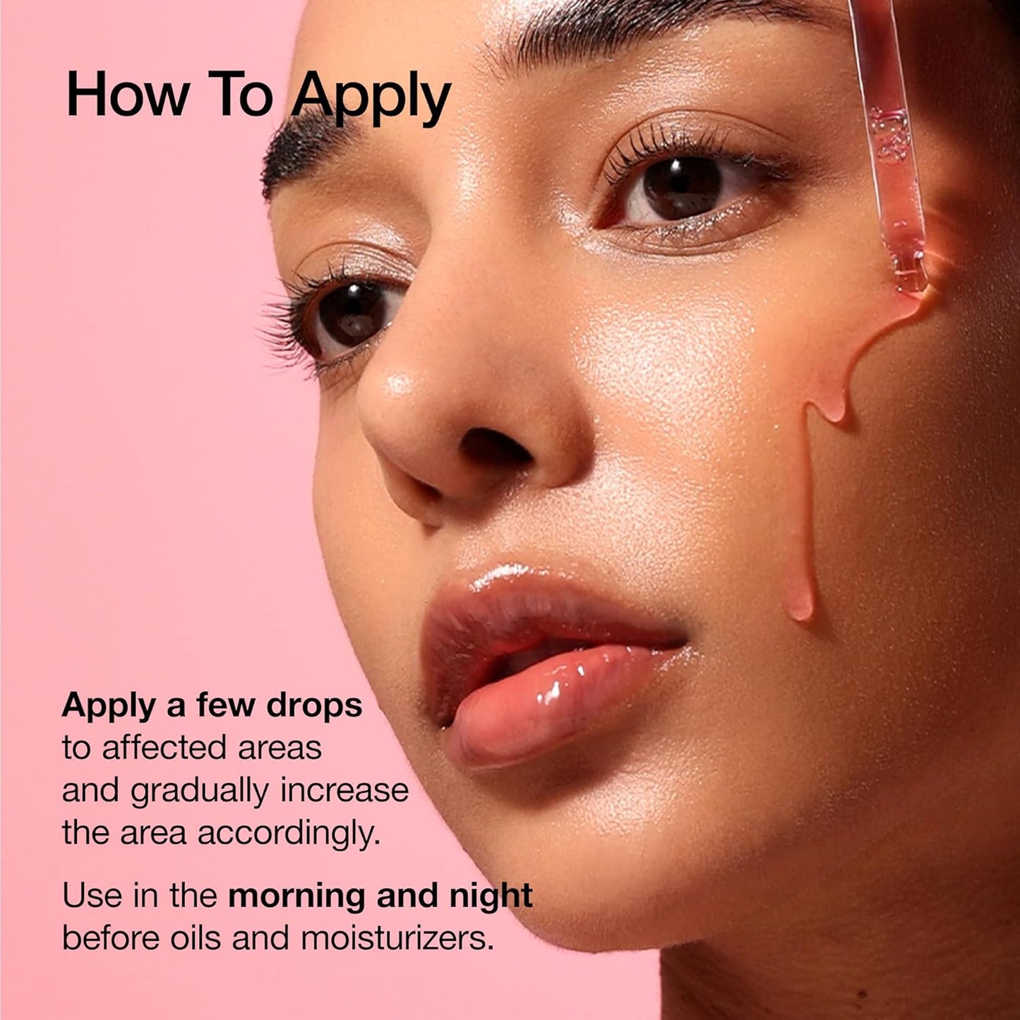 Skincare serum applied to face with glossy drops