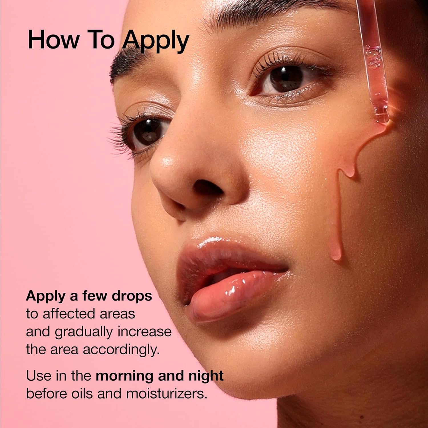 Skincare serum applied to face with glossy drops