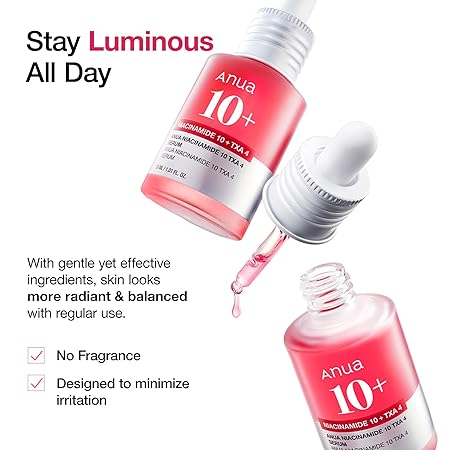 Two Anua 10+ serum bottles with silver droppers and clear glass drop