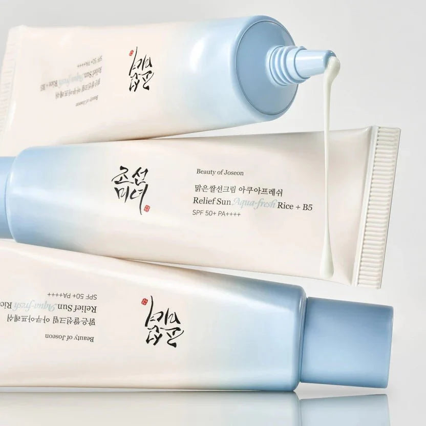 Beauty sunscreen tubes with light blue flip cap and nozzle dispensing cream