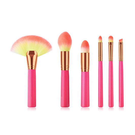 Makeup brush set with pink handles, gold ferrules, fan brush and tapered detail brushes