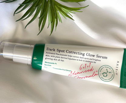 Dark spot correcting glow serum bottle with green cap, AXIS-Y label
