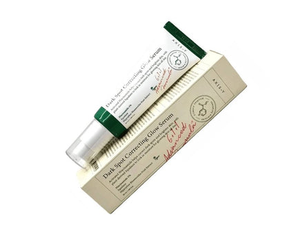 AXIS-Y dark spot correcting glow serum tube and box, green cap
