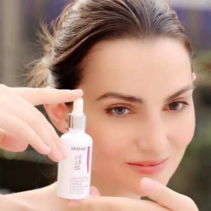 DR-RASHEL whitening fade spot serum bottle and dropper applied near face