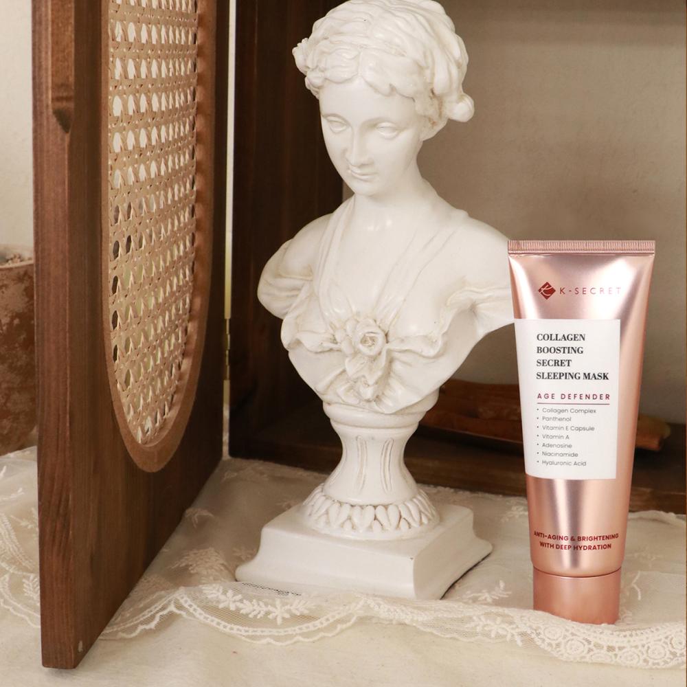 Collagen sleeping mask tube next to white stone statue, K-SECRET