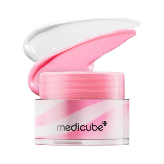 Pink lip balm cream swatch and open jar lid with closed mask container
