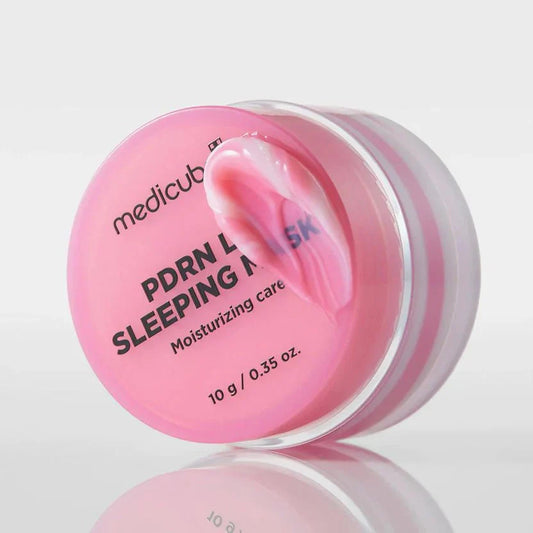 Pink lip sleeping mask jar with open lid and glossy cream inside