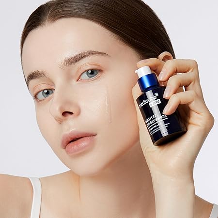 Woman applying Medicube Zero Pore One-day Serum using a small dropper bottle