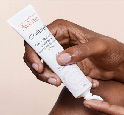 Cicalfate+ protective repair cream tube squeezed onto hand