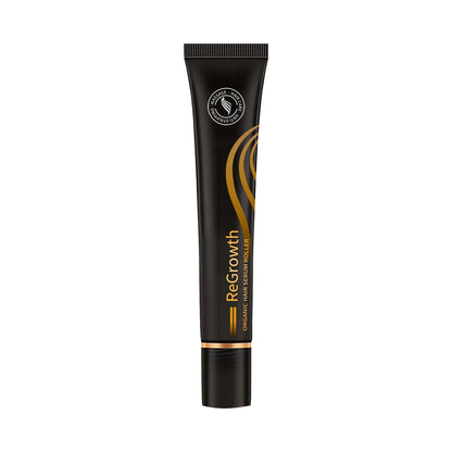 Black hair growth serum tube with gold swirl accents and ribbed cap
