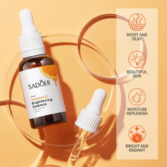 Vitamin C brightening essence bottles with droppers and amber liquid