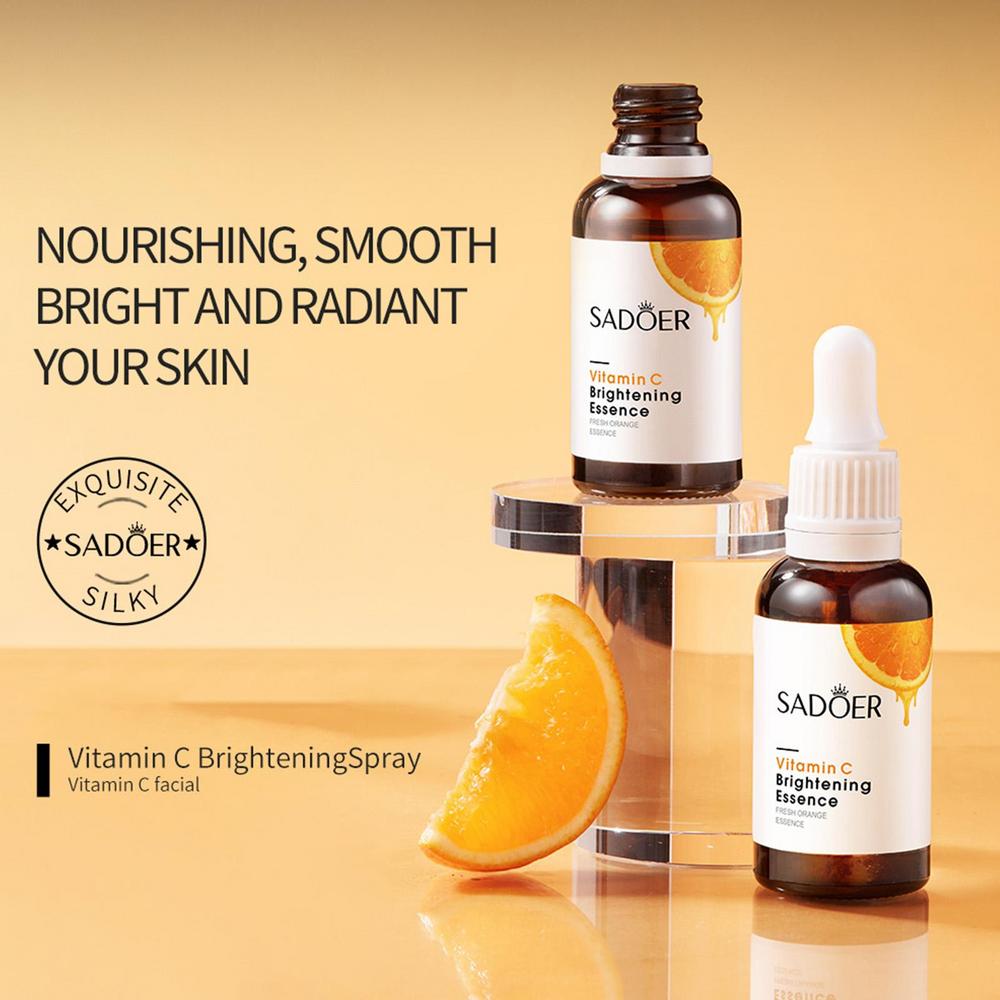 Vitamin C brightening essence bottles with droppers and orange slice accents