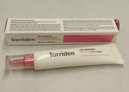 Torriden eye cream box and cream tube with pink cap, lying on a flat surface