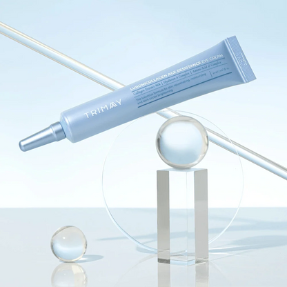 Light blue eye cream tube with applicator tip, lying on its side