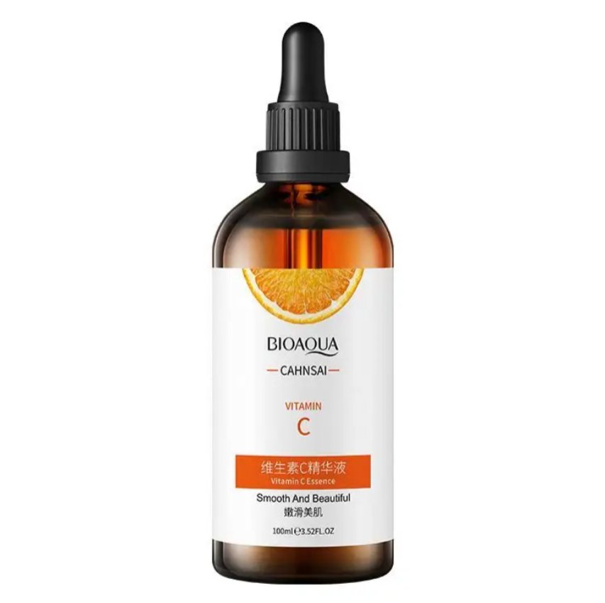 Vitamin C face serum bottle with black dropper, amber glass and orange label