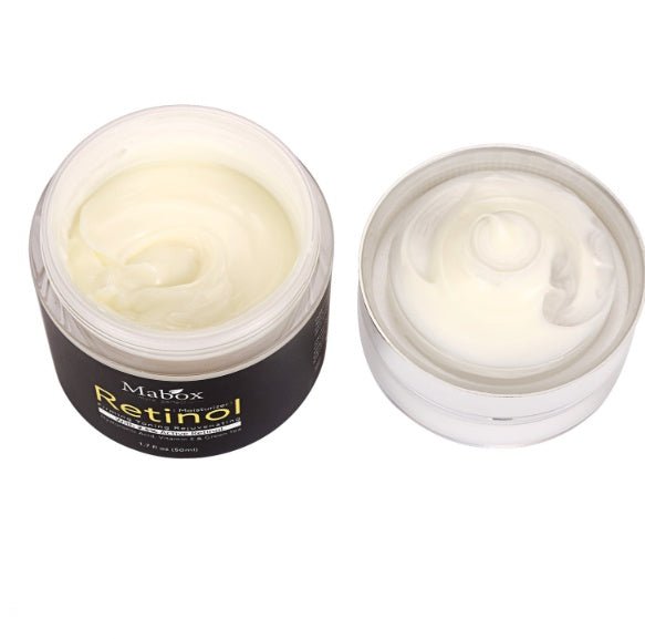 Opened MaBox retinol eye cream jar with pale cream inside, silver rim